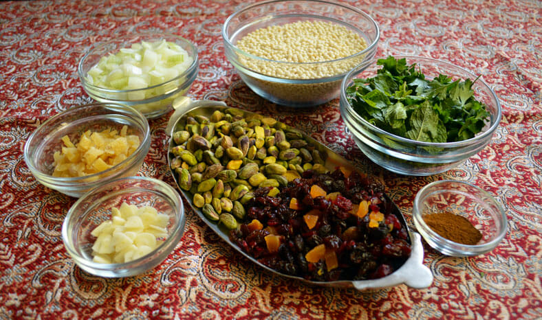 View of ingredients - parsley, onion, dry fruits, unsalted pistachio, unsalted butter, garlic, couscous