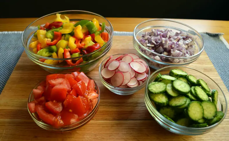 Chopped tomatoes, radish, onions, cucumbers and bell peppers for dish