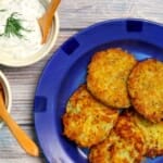 Potato fritters with applesauce and Greek yogurt with dill