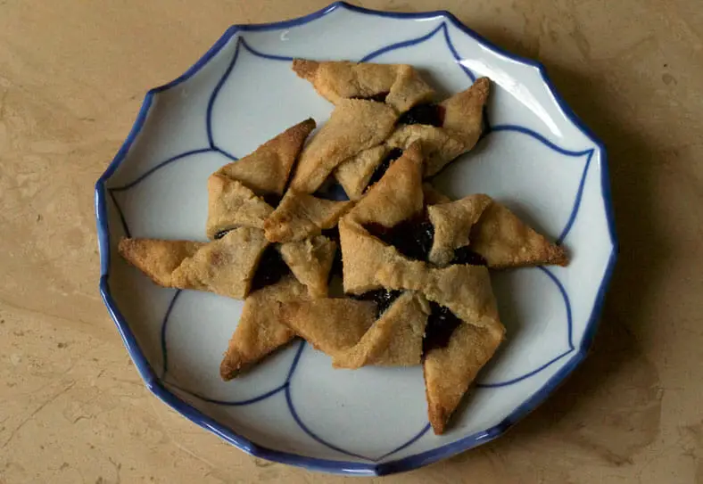 Pinwheel pastries with prune jam in ceramic serving plate