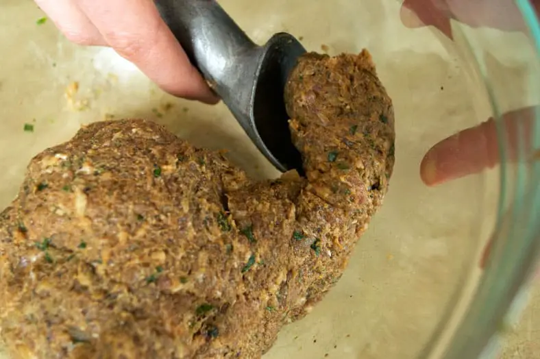 Scoop of minced sausage meat for balls