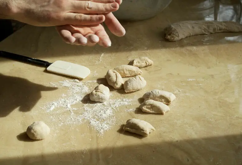 Cutting of dough into equal parts for dumplings