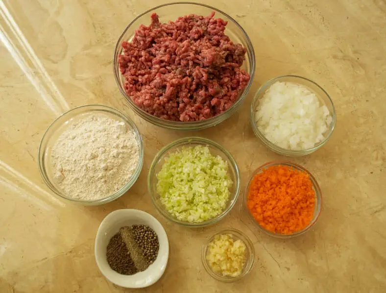 View of ingredients - pork, carrot, cabbage, flour, garlic, spices