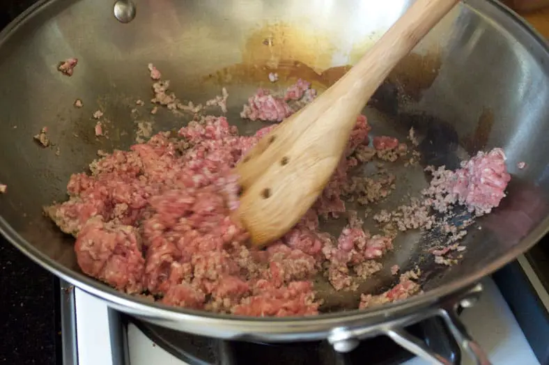 Cooking of minced pork in wok