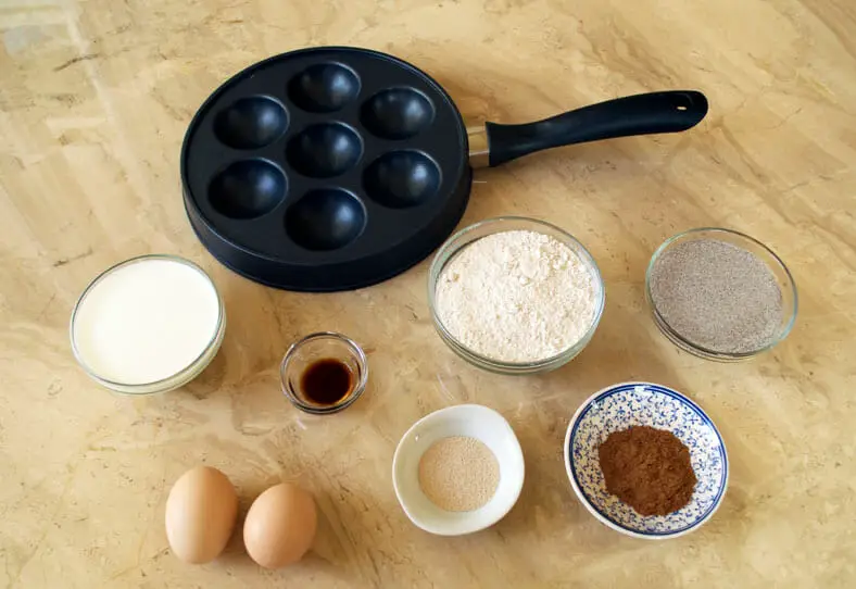 View of ingredients - flour, egg, yeast, dimple pan