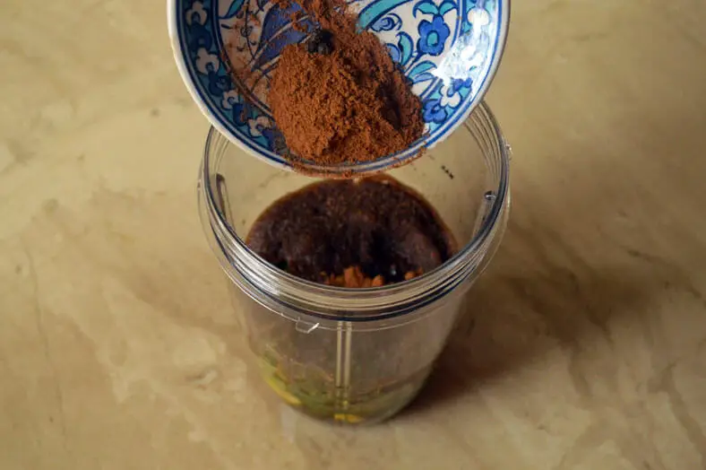 Adding spices to the jar for blending