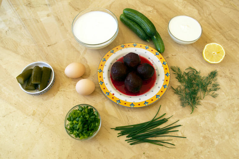 Ingredients for beet soup - beet, eggs, lemon, chives, spring onions, cucumbers, gerkin pickles, Greek yogurt
