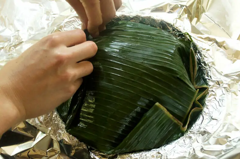 Ready to serve dish with cooked banana leaf