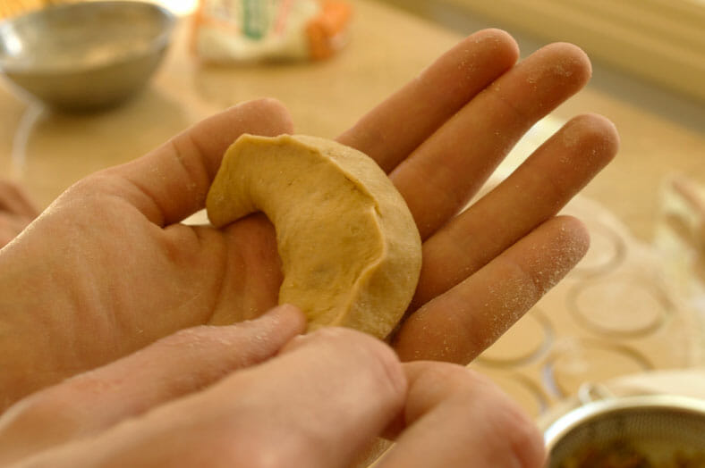 Pinching the dough together at the ends