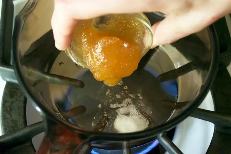 Mixing coconut oil and honey over low heat
