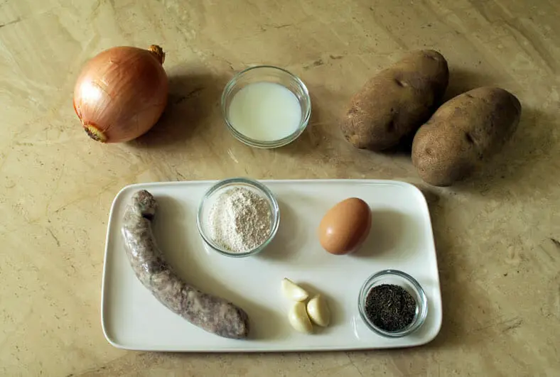 Ingredients - potatoes, egg, garlic, sausage, red onion, flour