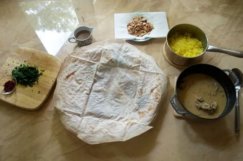 All cooked ingredients ready to assemble Jordanian Mansaf - lamb, yogurt and rice pilaf