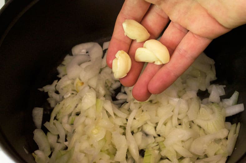 Creating a base of onions and garlic for the Jordanian Mansaf dish that consists of Lamb, Yogurt and Rice Pilaf