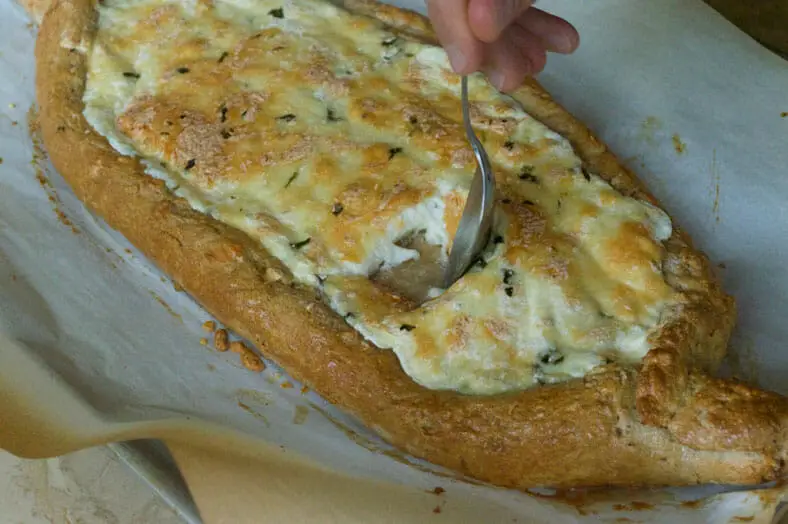 Move over cheese, we have an egg to drop in a half baked Khachapuri - Georgian Cheese Bread