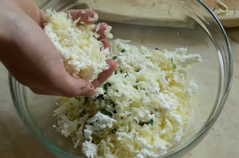 Making the cheese filling for the bread boat (Khachapuri - Georgian Cheese Bread)