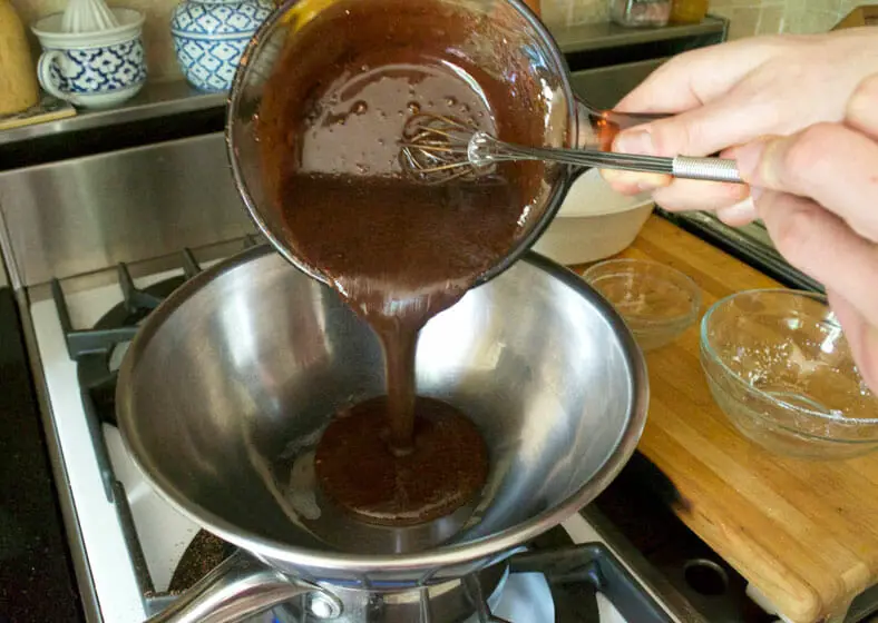 Adding cocoa and powdered sugar for the chocolate dipping sauce