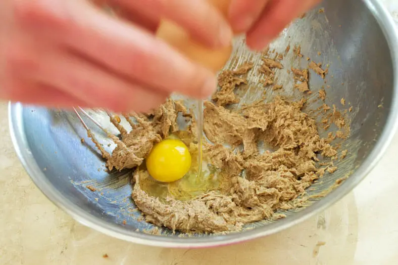 Adding eggs to the mixture