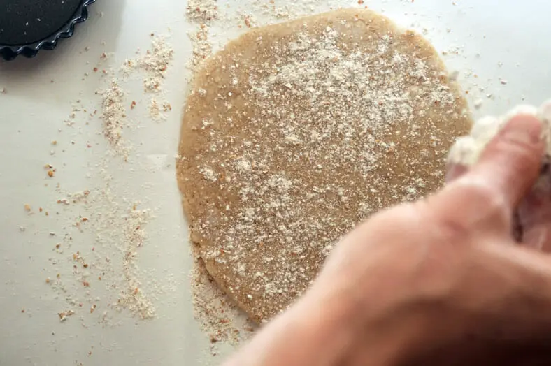 Sprinkling flour on the pie crust 