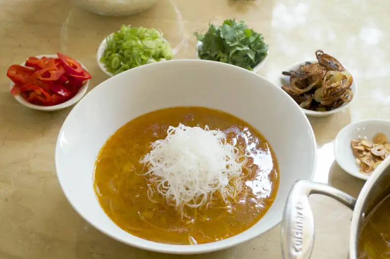 Place vermicelli rice noodles right in the center of the soup in serving bowl