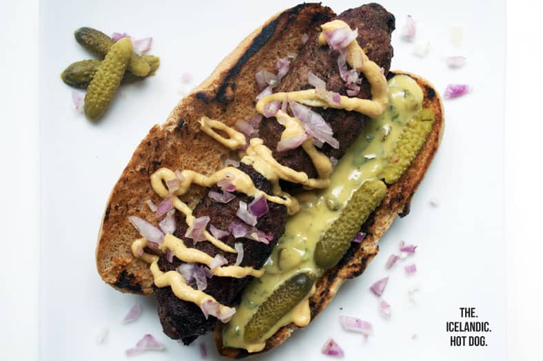 Pylsur, the infamous Icelandic hot dog topped with homemade mustard, remoulade, raw onions and cornichon