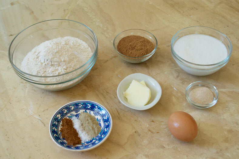 Ingredients - eggs, butter, flour, sugar, yeast, cardamom powder, coconut milk