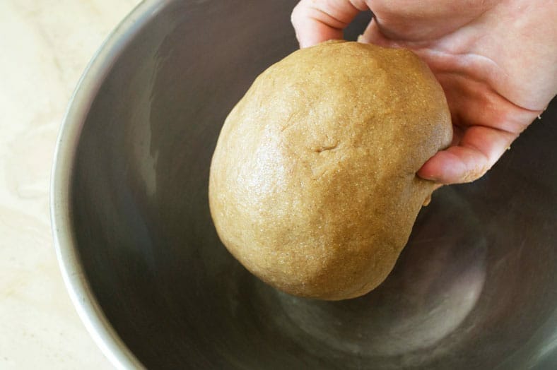 Placing dough into bowl for resting