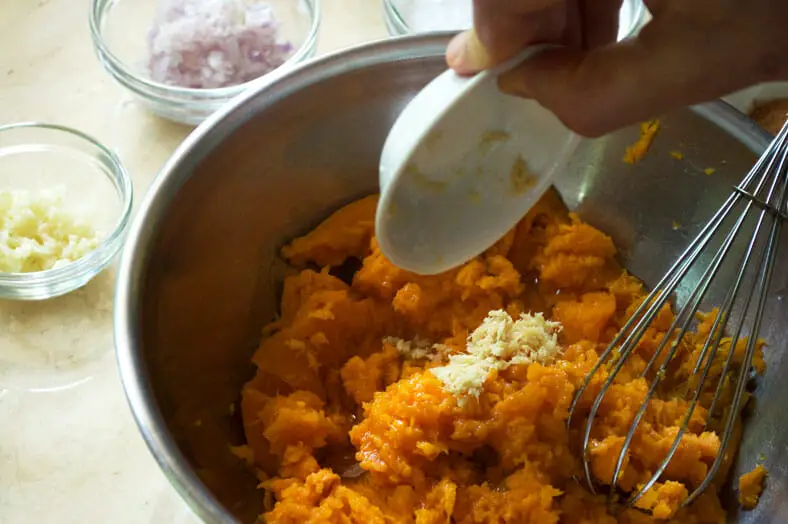 Add ginger into the scooped sweet potato