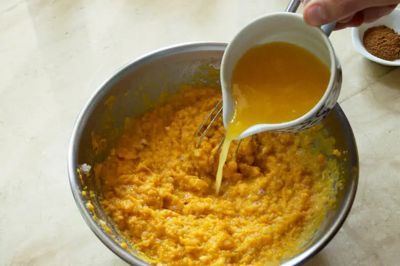 Add orange juice into the scooped sweet potato