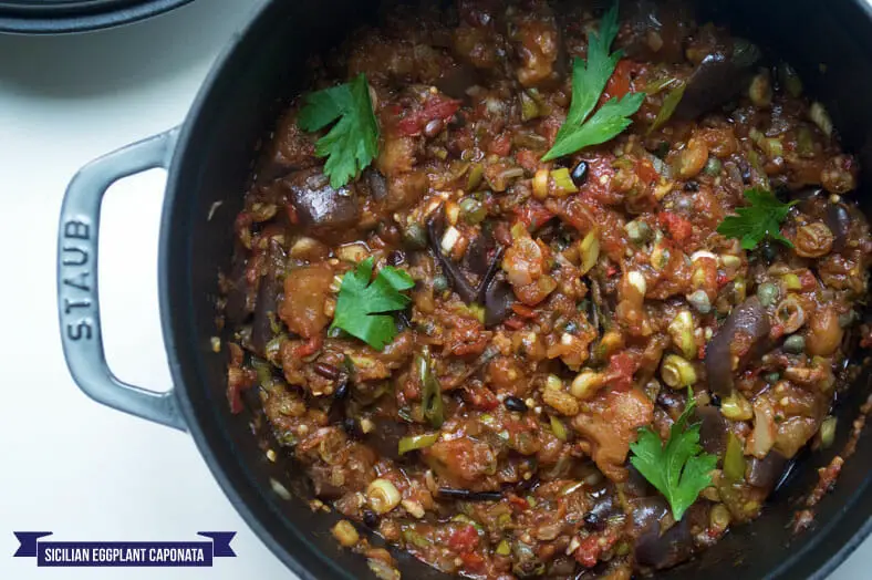 This is caponata, a classic Sicilian dish of stewed aubergines or eggplant, complete with loads of vegetables, fresh herbs and spices and lovely balance between sweet and sour
