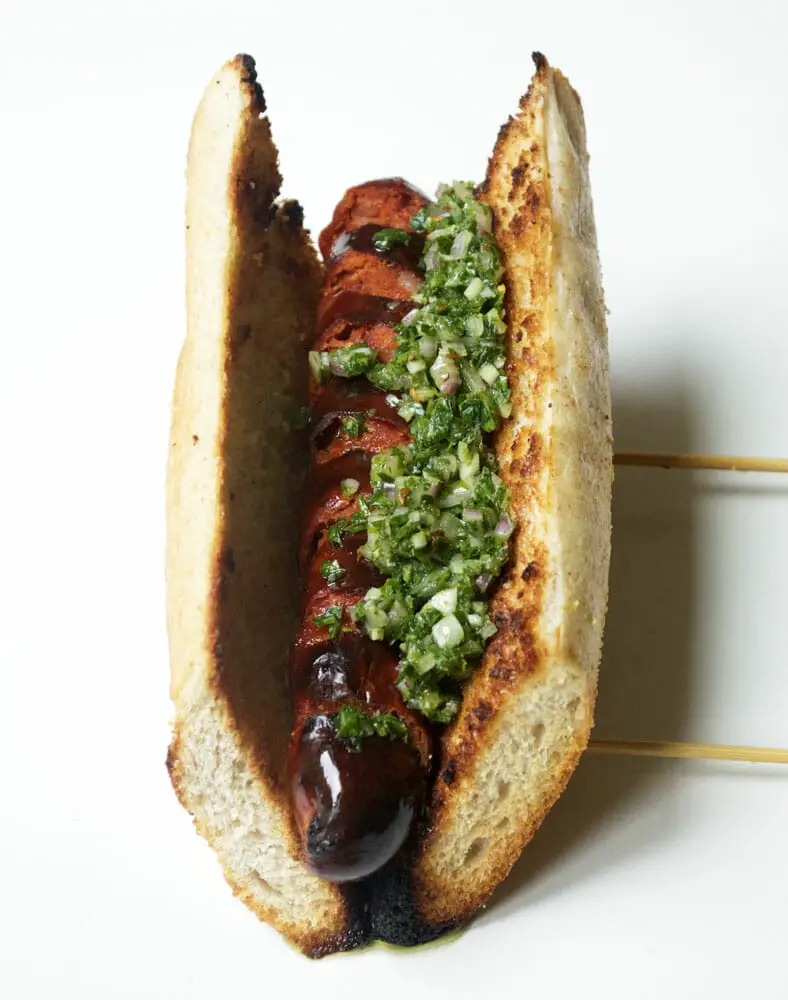 A staple of Argentinian cuisine, often sold as street food. It’s essentially a grilled chorizo sausage inside a toasted baguette topped with a heaping dollop of chimichurri.