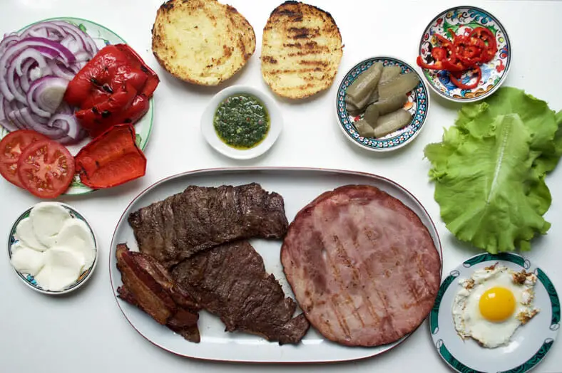 Here are all the prepared and grilled meats and other ingredients need to build the sandwich