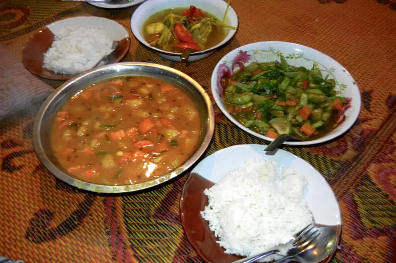 Our simple meal of eggplant curry, potato curry, rice and more in the jungles outside Chiang Mai