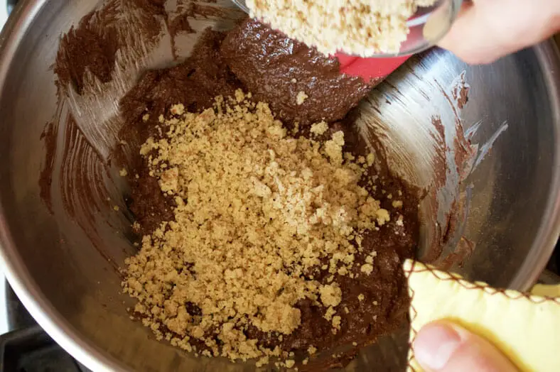 After you make your rugelach dough, you'll want to prepare your filling. Here we are melting chocolate, which we will then combine with raisins, cinnamon, sugar and crushed walnuts