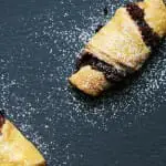 These little delights are called Rugelach, a traditional Jewish croissant pastry often served during Hanukkah. The dough makes a great vehicle for any number of fillings, but we opted to fill our rugelach with chocolate, walnuts, raisins and cinnamon.