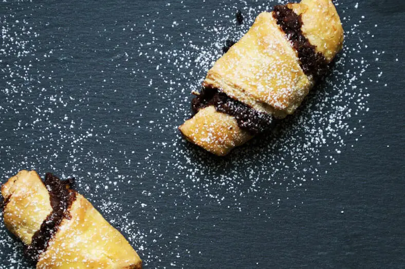 These little delights are called Rugelach, a traditional Jewish croissant pastry often served during Hanukkah. The dough makes a great vehicle for any number of fillings, but we opted to fill our rugelach with chocolate, walnuts, raisins and cinnamon.