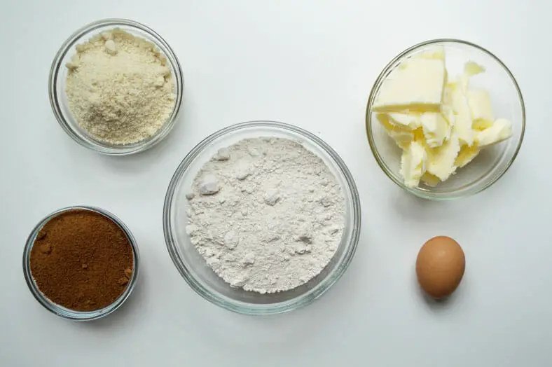 View of ingredients - butter, egg, flour, almond meal and sugar