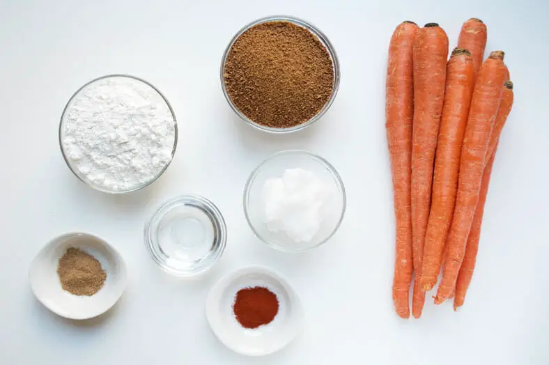 Your ingredients for a scrumptious vegan halva ye havij (Persian sweet carrot confection): carrots, rice flour, coconut oil, coconut sugar, ground cardamom, rosewater, crushed saffron. That's it!