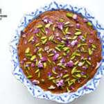 Carrot cake in a bowl with pistachio garnishing
