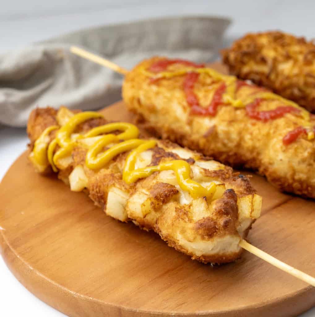 korean corn dog 3 different types of drizzle on top