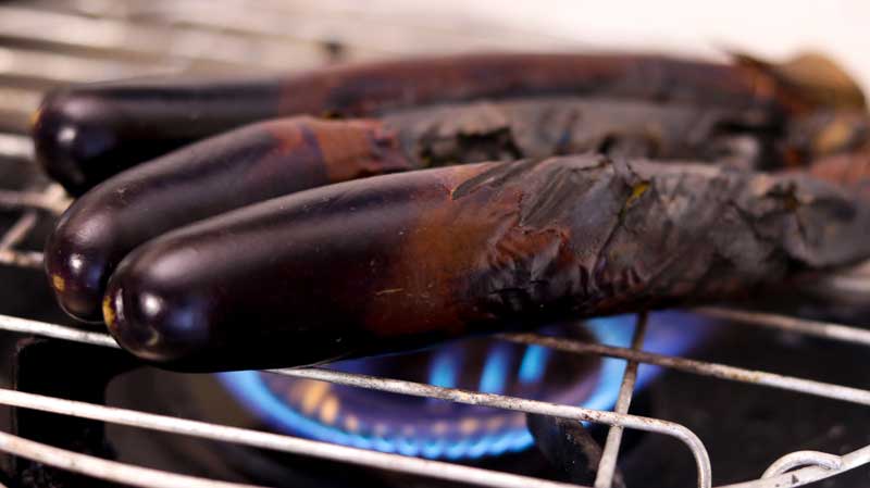 Roasting eggplant on open flame