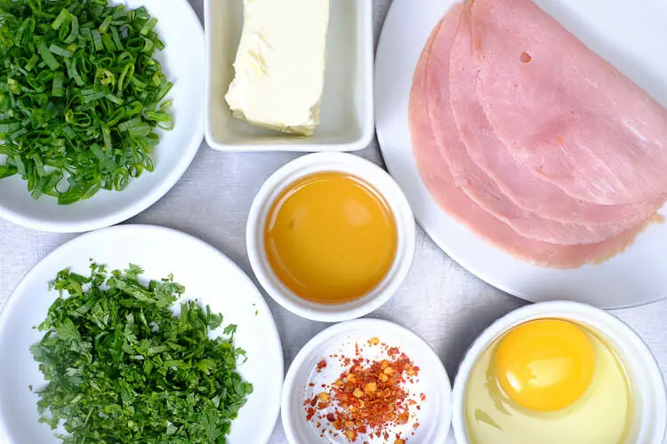 View of ingredients - Chinese ham, egg, cilantro, sesame oil, cream cheese, scallions