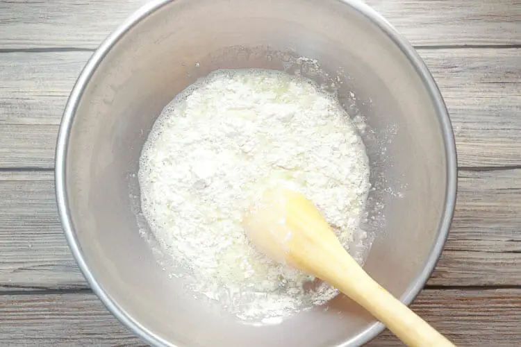 Adding flour to the liquid mixture