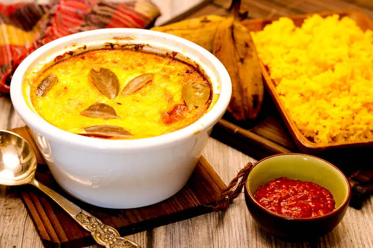 Perfectly baked meat dish served with yellow rice and Mrs. Ball's hot chutney