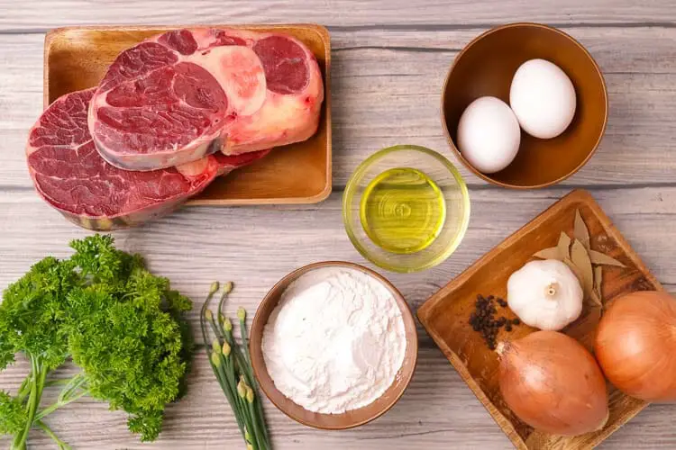 View of ingredients - onions, eggs, oil, beef shank