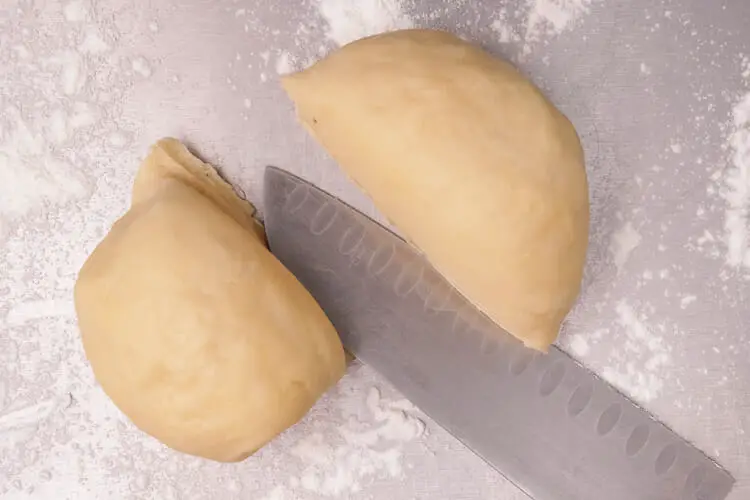 Cutting of dough into 2 workable portion