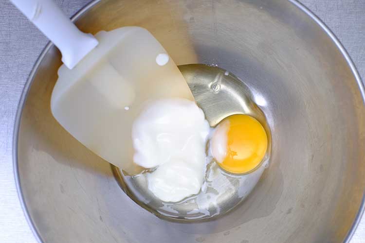 Beaten egg and yogurt in a bowl