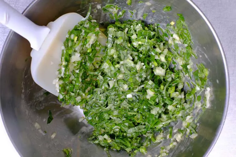 Mix yogurt and egg mixture with spinach, onions and herbs