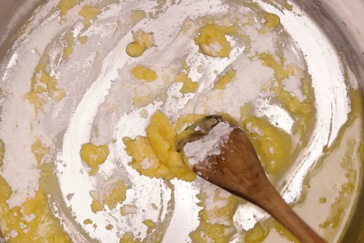 Mixing of butter and flour in a pan