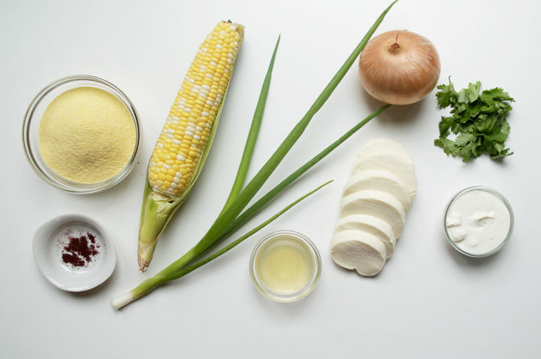 View of ingredients - corn, onions, cheese, corn flour, lemon juice