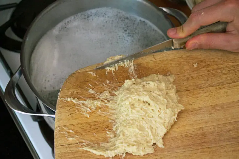 Scraping gnocchi sized pieces into boiling water
